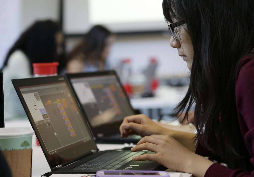 girls working on a laptop