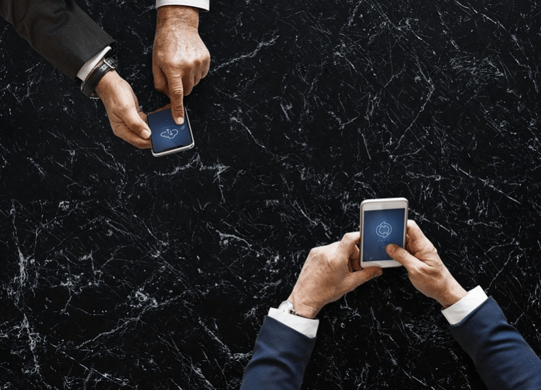 two men with two phones